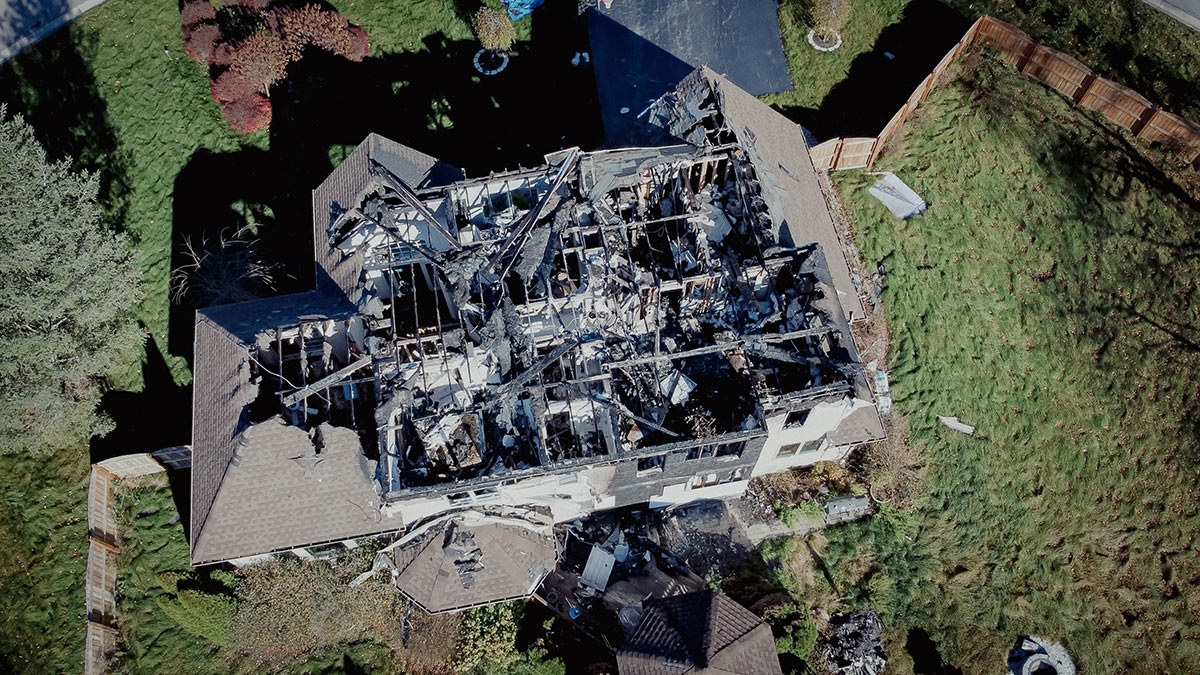 House with fire damaged roof House with fire damaged roof